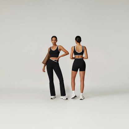 Two views of a person wearing black athletic pants and a sports bra on a plain background make sure I can see this full set 
